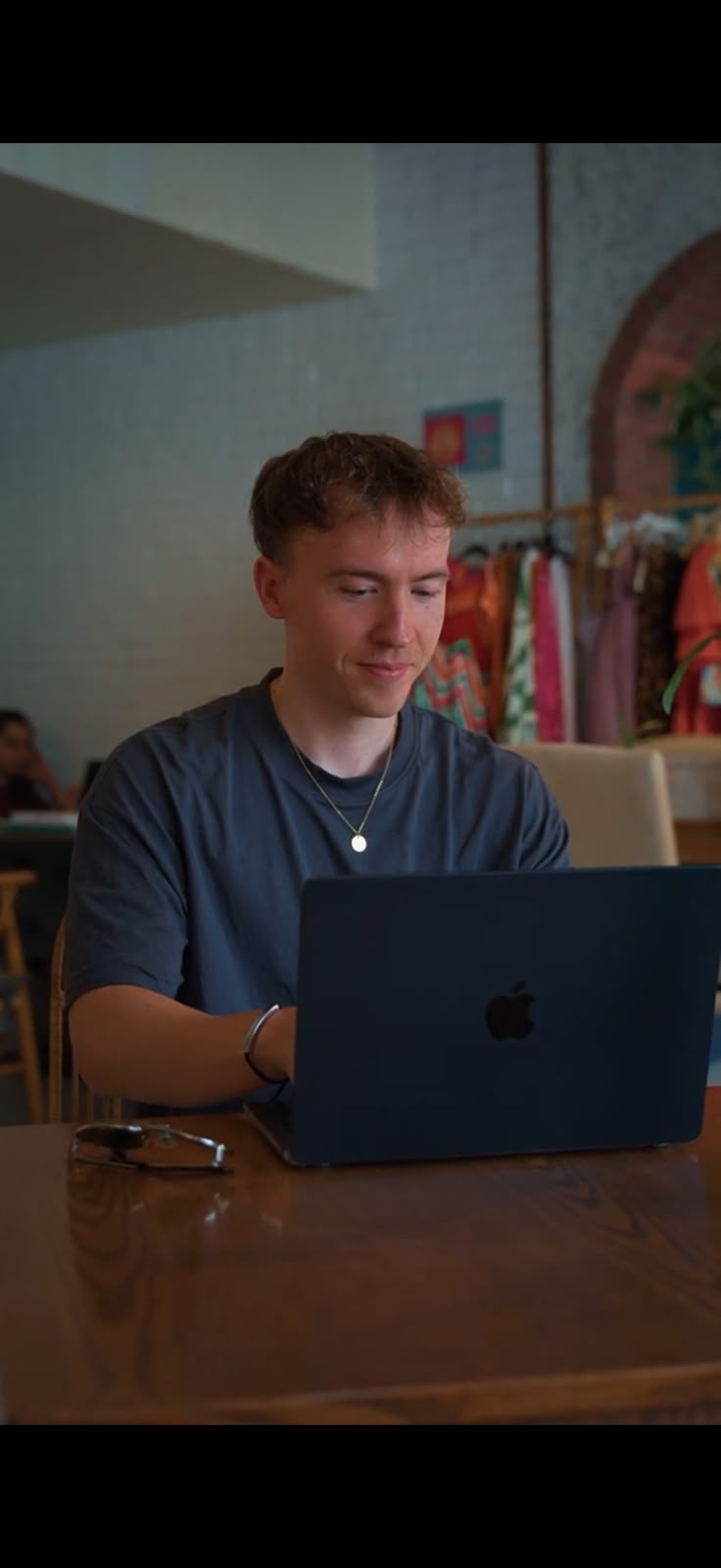 Tom Ashworth working on a laptop